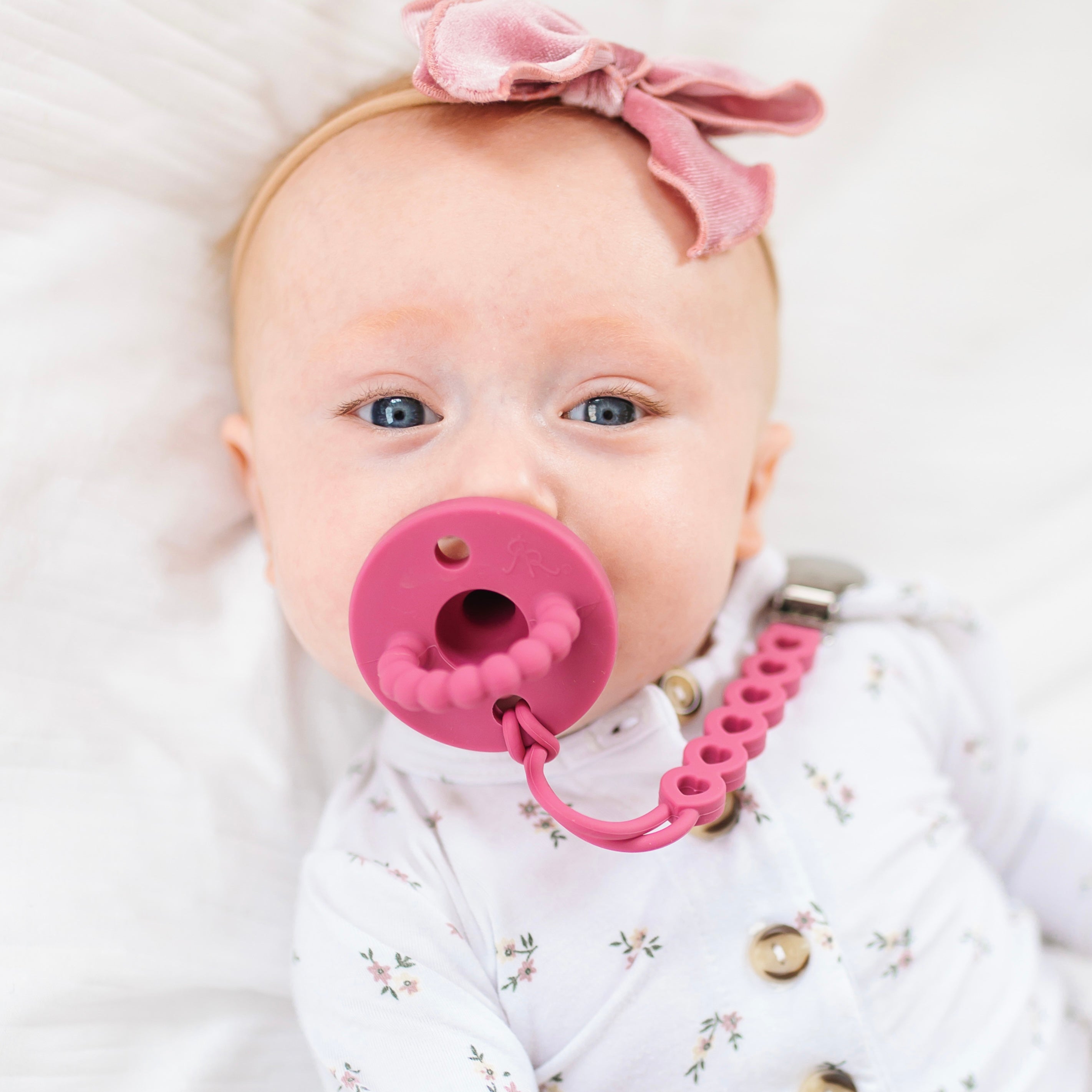 Baby girl wearing a Rouge Cutie PAT and Hart Cutie Clip.