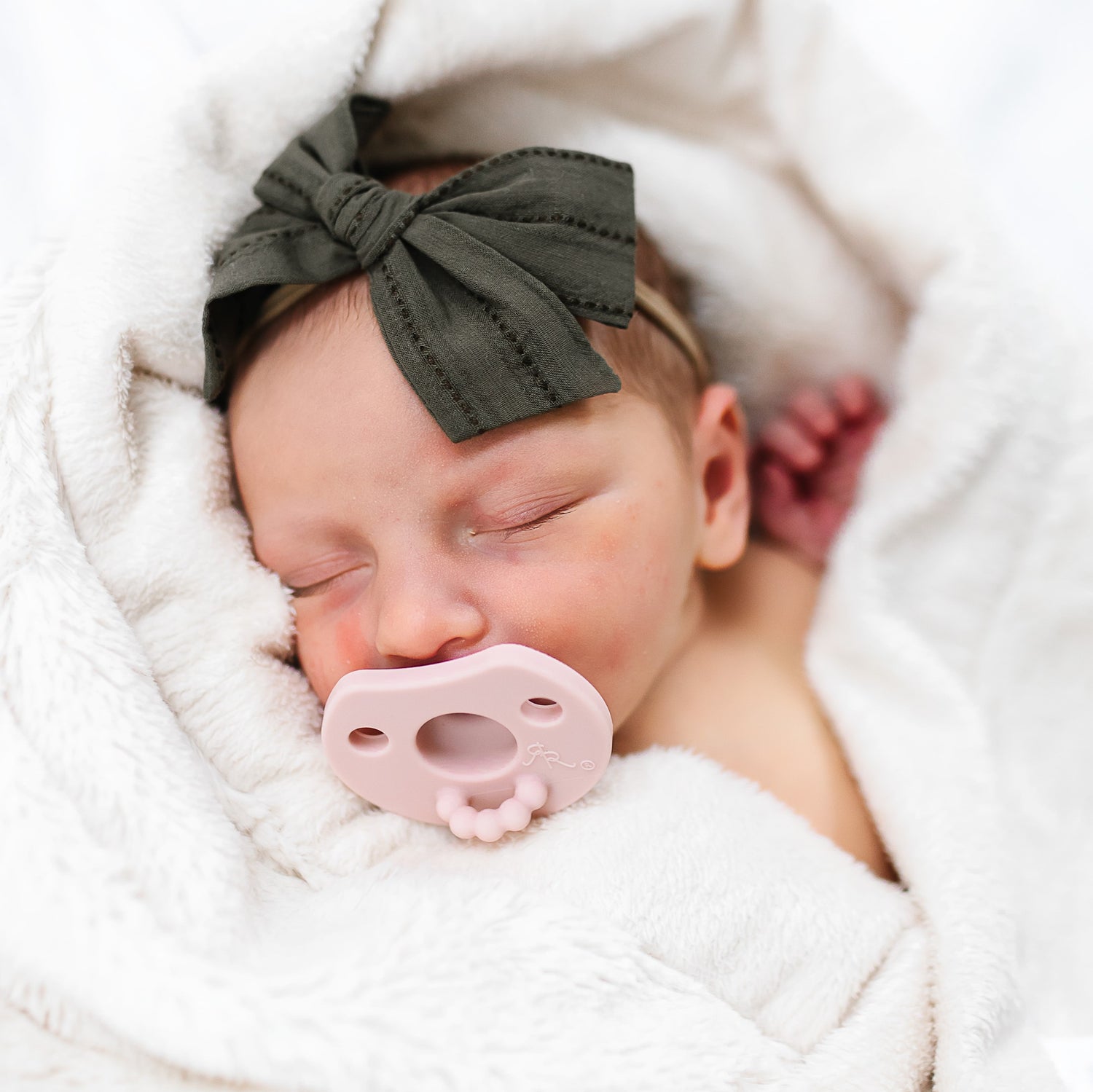 Baby using Blush Cutie Preemie.