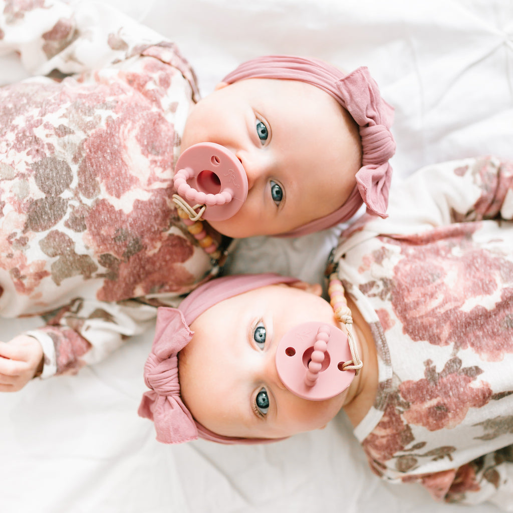 Twin babies using Rose Cutie PAT Round.